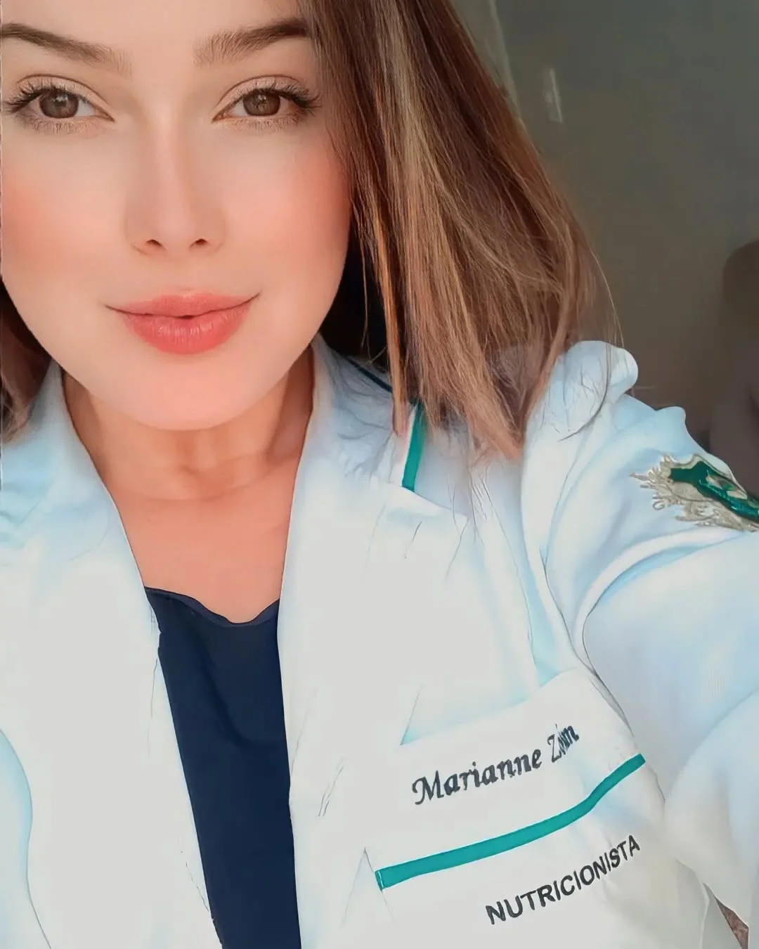 Retrato de Marianne Zordan de jaleco de nutricionista